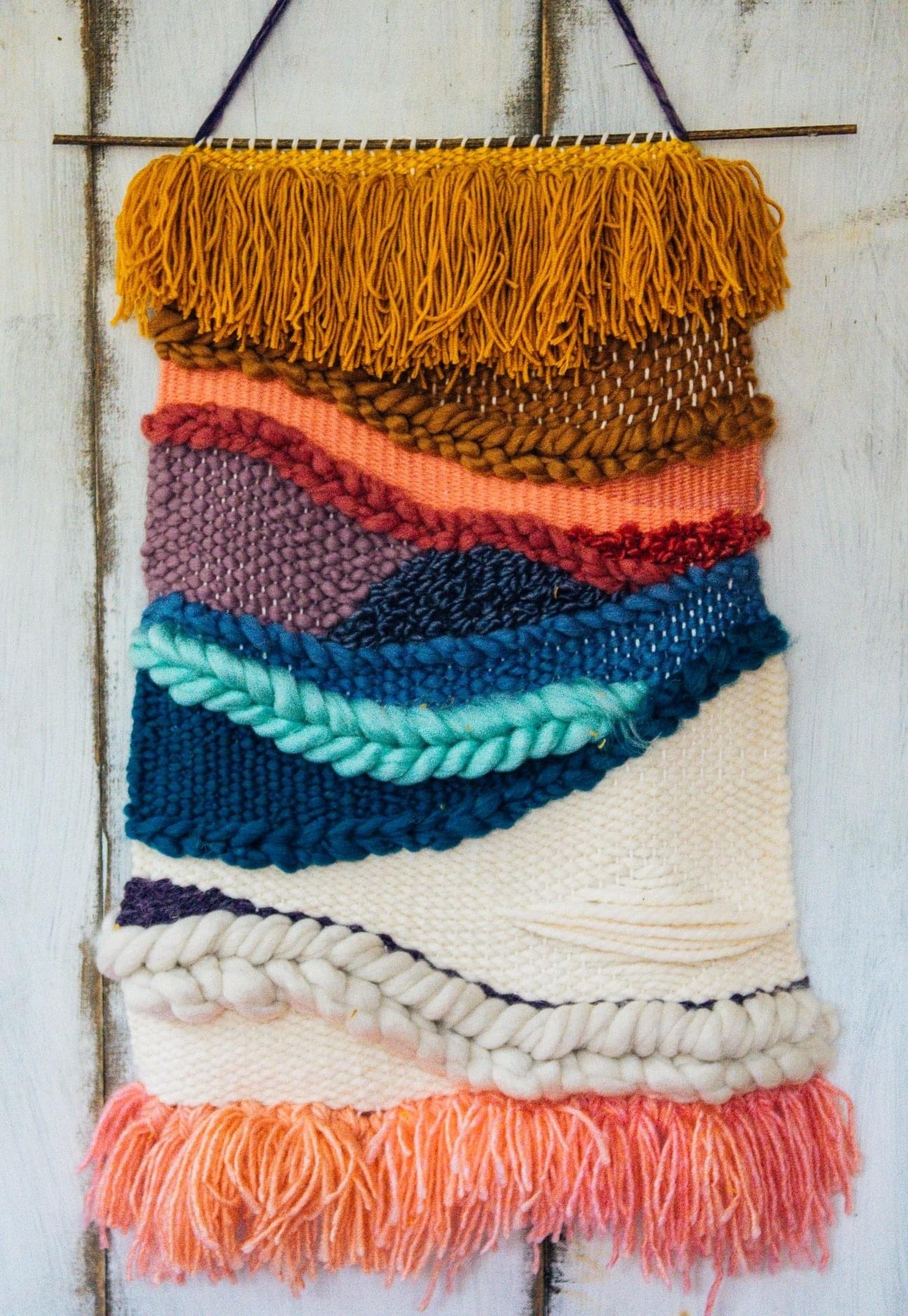 Handmade colorful woven tapestry wall hanging by Meg and Roe Photography 